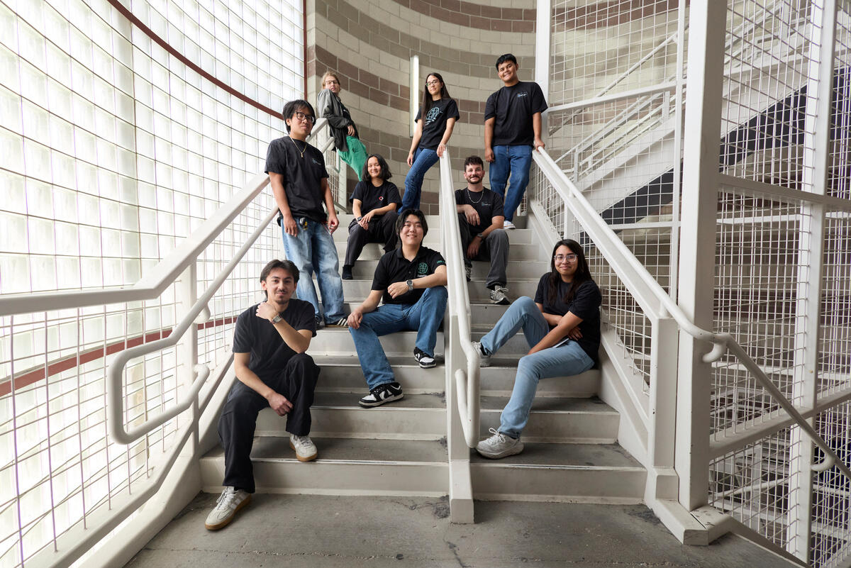 UNLV cybersecurity team members on a campus stairway
